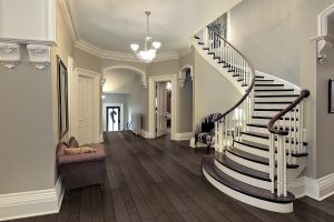 Foyer in traditional suburban home with curved staircase